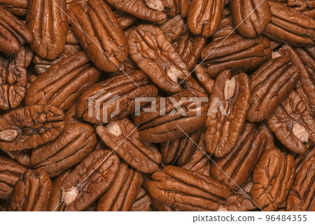 Pecan nuts as background Pecan nuts as background 96484355