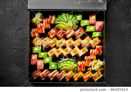 Large set of various Japanese sushi rolls in cardboard box Large set of various Japanese sushi rolls in cardboard box 96485924