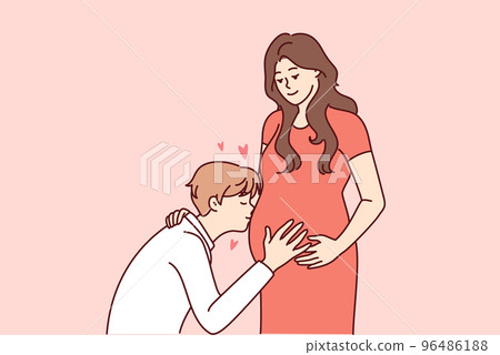 Happy man kiss pregnant woman belly Happy man kiss pregnant woman belly 96486188