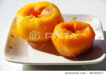 Clumsily peeled persimmon Clumsily peeled persimmon 96486827