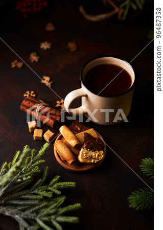 Mug of hot chocolate and Christmas decorations 96487358