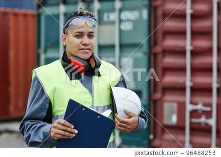 Female worker looking at camera outdoors 96488253