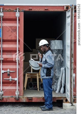Side view portrait of male worker at shipping dock 96488262
