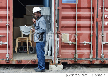 Graphic portrait of worker at shipping dock 96488264
