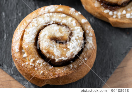 Cinnamon rolls buns on wooden table. Kanelbulle Swedish dessert 96488958
