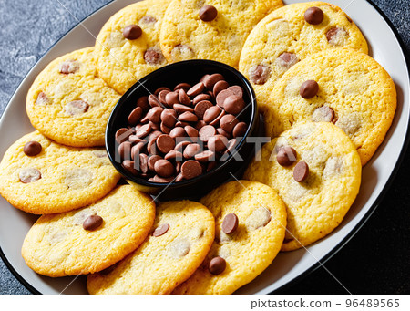 chocolate chip lemon yellow cookies on a plate chocolate chip lemon yellow cookies on a plate 96489565