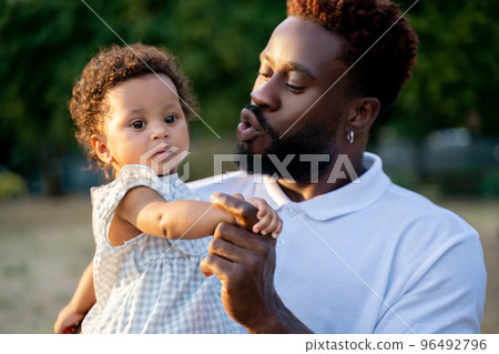 Caring father spending time with his daughter outdoors 96492796