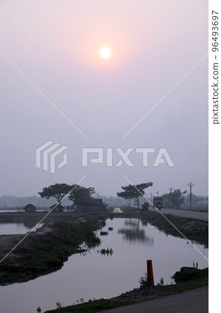 A stunning sunset looking over the holiest of rivers in India. Ganges delta in Sundarbans, West Bengal, India 96493697