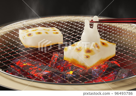 Kirimochi puffed up in the shape of a rabbit picked with chopsticks / Graphic image of the year of the rabbit, New Year's card, New Year Kirimochi puffed up in the shape of a rabbit picked with chopsticks / Graphic image of the year of the rabbit, New Year's card, New Year 96493786