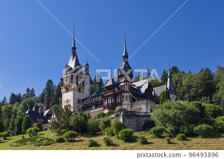 Peles Castle amongst other monuments, surrounded by pretty landscape with gardens, Sinaia, Romania Peles Castle amongst other monuments, surrounded by pretty landscape with gardens, Sinaia, Romania 96493896