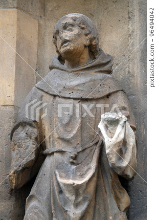 Statue of Saint on the portal of the Saint Germain l'Auxerrois church in Paris, France Statue of Saint on the portal of the Saint Germain l'Auxerrois church in Paris, France 96494042
