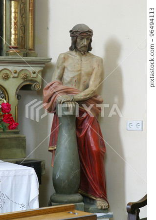 Christ at the Column, the statue in the parish church of Saint John the Baptist in Sveti Ivan Zelina, Croatia Christ at the Column, the statue in the parish church of Saint John the Baptist in Sveti Ivan Zelina, Croatia 96494113