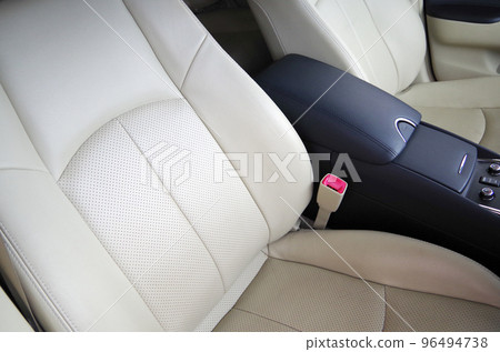 Bright beige genuine leather seats of a passenger car about 10 years old Bright beige genuine leather seats of a passenger car about 10 years old 96494738