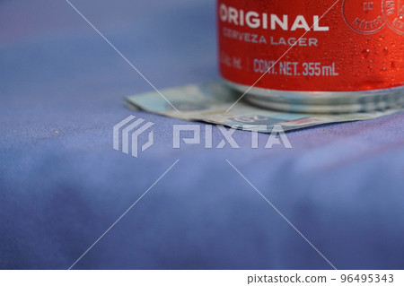mexican beer can on a pesos note check 96495343
