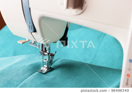 Modern sewing machine and turquoise fabric 96496549