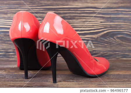 Red high heel women shoes on brown background 96496577