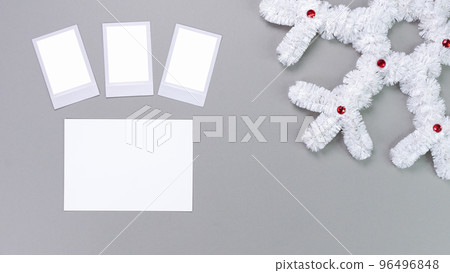 Polaroid retro photo frames isolated on grey background. Real photo template. Three frames. Mockup. Christmas white fluffy snowflake. Winter decoration. 96496848