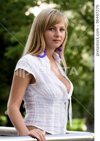 Young pretty woman in summer day 96497276