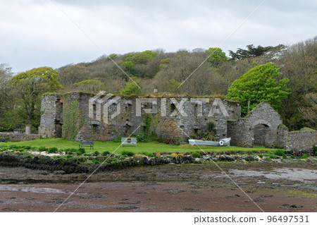 The Arundel grain store, shore of Clonakilty Bay. An stone building. Historical architectural monument, landscape. Tourist attractions in Ireland The Arundel grain store, shore of Clonakilty Bay. An stone building. Historical architectural monument, landscape. Tourist attractions in Ireland 96497531