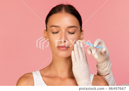Beautician Doctor Making Injection To Beautiful Woman With Drawn Mesh On Face Beautician Doctor Making Injection To Beautiful Woman With Drawn Mesh On Face 96497667