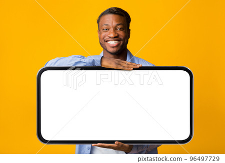 Handsome Black Man Holding Big Blank Smartphone With Empty White Screen 96497729