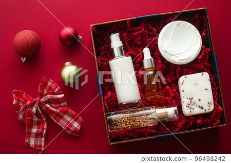 Christmas gift set, xmas holidays beauty box subscription package and luxury skincare products flatlay, cosmetic flat lay on red background, cosmetics as holiday present or shopping delivery, top view 96498242