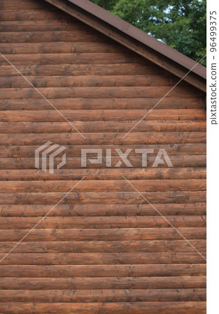 The wall of the wooden house 96499375