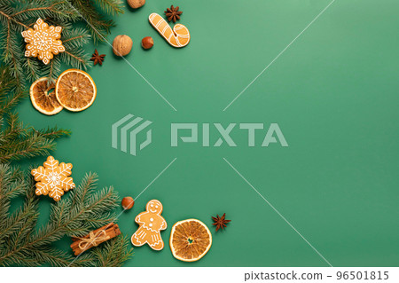 Festive composition, Christmas background, gingerbread, Christmas toys fir branches green background 96501815