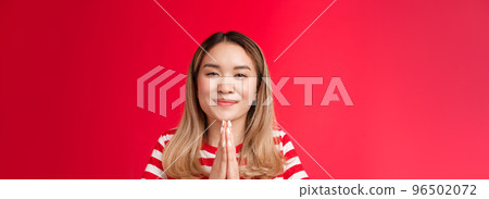 Thankful cute happy asian girl bowing politely show namaste gesture gladful. Joyful attractive blonde hold hands pray appreciate help begging favour, stand relaxed outgoing red background Thankful cute happy asian girl bowing politely show namaste gesture gladful. Joyful attractive blonde hold hands pray appreciate help begging favour, stand relaxed outgoing red background 96502072