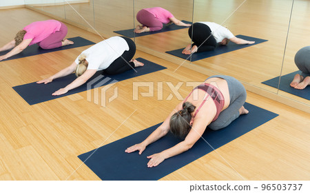 Mature women are exercising child's pose Mature women are exercising child's pose 96503737
