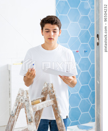 Young man owner is shocked by the estimate for the renovation of cottage Young man owner is shocked by the estimate for the renovation of cottage 96504232