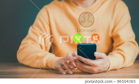 Man answering to incoming call. Phone call from unknown number. Call center gang, scammer or stranger. Hoax person with fake identity. Scam, fraud or phishing with mobile phone or smartphone concept. Man answering to incoming call. Phone call from unknown number. Call center gang, scammer or stranger. Hoax person with fake identity. Scam, fraud or phishing with mobile phone or smartphone concept. 96504365