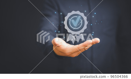 Quality assurance of business services, Businessman holding and showing the best quality assurance with golden five stars. Guarantee, Standards, ISO certification and testimonial concept. 96504366