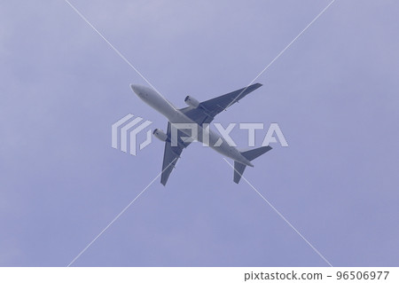 Passenger plane flying in the blue sky Passenger plane flying in the blue sky 96506977