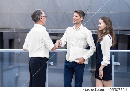 business colleagues greeting each other in the corridor of the business center. business colleagues greeting each other in the corridor of the business center. 96507734
