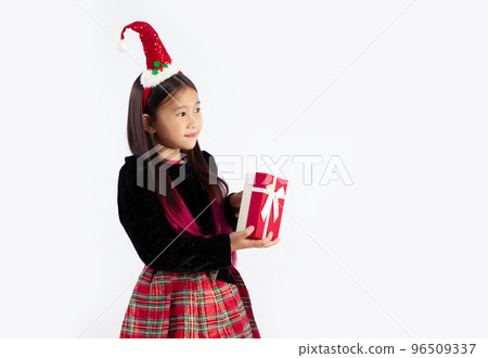 Merry Christmas, little girl in Christmas theme costume posing happy to celebrate and party white background. Merry Christmas, little girl in Christmas theme costume posing happy to celebrate and party white background. 96509337