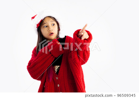 Merry Christmas, little girl in Christmas theme costume posing happy to celebrate and party white background. Merry Christmas, little girl in Christmas theme costume posing happy to celebrate and party white background. 96509345