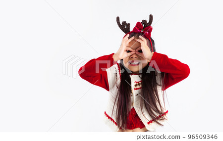 Merry Christmas, little girl in Christmas theme costume posing happy to celebrate and party white background. 96509346