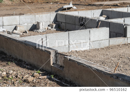 A demolition site with the foundations of a house still standing A demolition site with the foundations of a house still standing 96510162