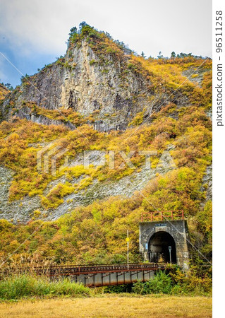 Tadami Line Rokujurigoe Tunnel in autumn seen from Tagokura Free Rest Station (Tadami Town, Fukushima Prefecture, October) 96511258