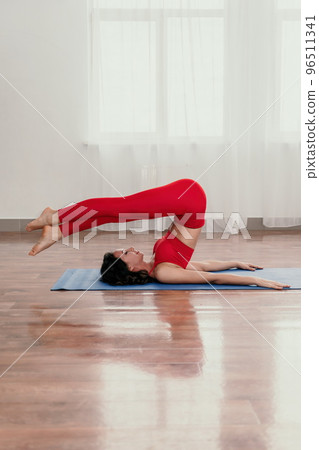 Middle aged well looking woman fitness instructor in red Sportsw Middle aged well looking woman fitness instructor in red Sportsw 96511341