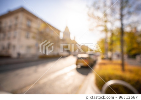 Autumn season bokeh background. Abstract city blur along the road with cars. 96512667
