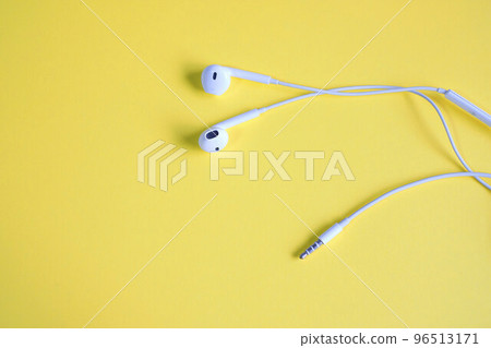 Wired earphone yellow background 96513171