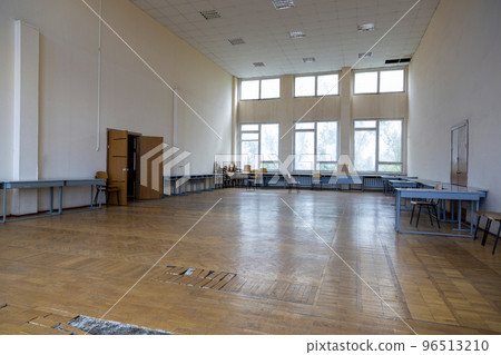 A fragment of the interior of a large hall in need of repair A fragment of the interior of a large hall in need of repair 96513210