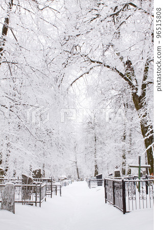Cemetery in winter under the snow. Cemetery in the snow cover Cemetery in winter under the snow. Cemetery in the snow cover 96515808