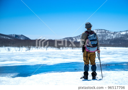Oguninuma and a male hiker in winter Oguninuma and a male hiker in winter 96517706