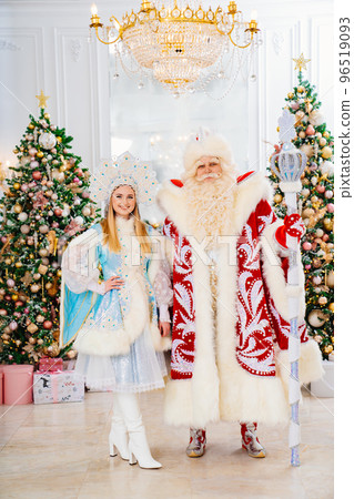 a Father Frost and Snow Maiden in the room with christmas trees a Father Frost and Snow Maiden in the room with christmas trees 96519093