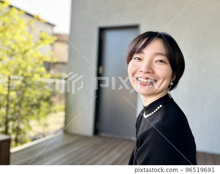 portrait of smiling woman with short hair 96519691