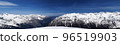 Panorama of high snow-capped mountain peaks and beautiful sky with clouds at sunny day. 96519903