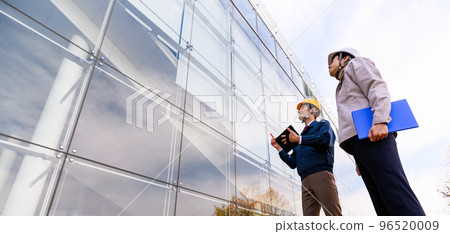 Business person doing inspection work 96520009